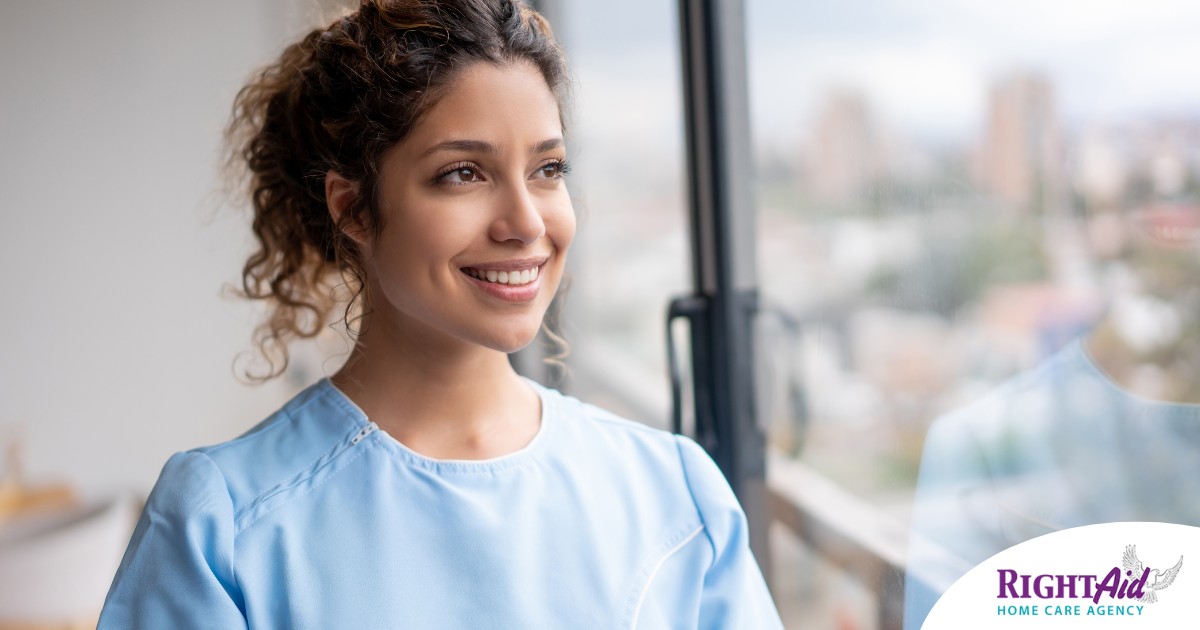 A caregiver smiles and looks hopeful, showing the kind of attitude that can help new professional caregivers.